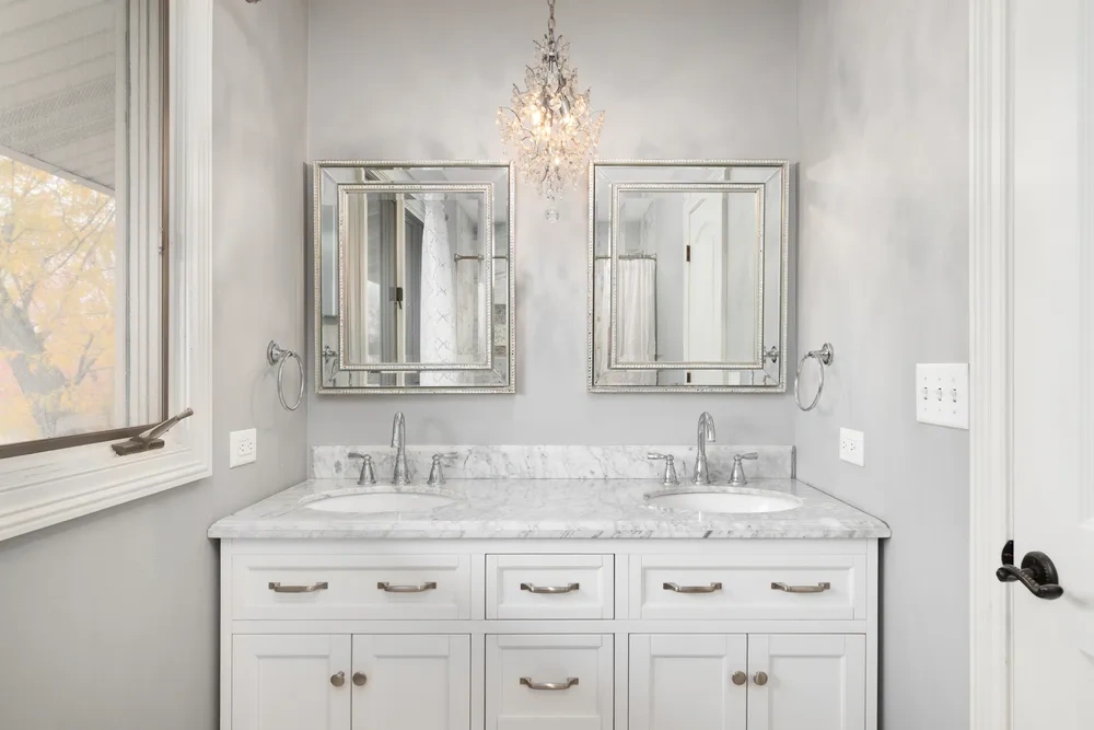 Double vanity in a bright bathroom with a quartz countertop