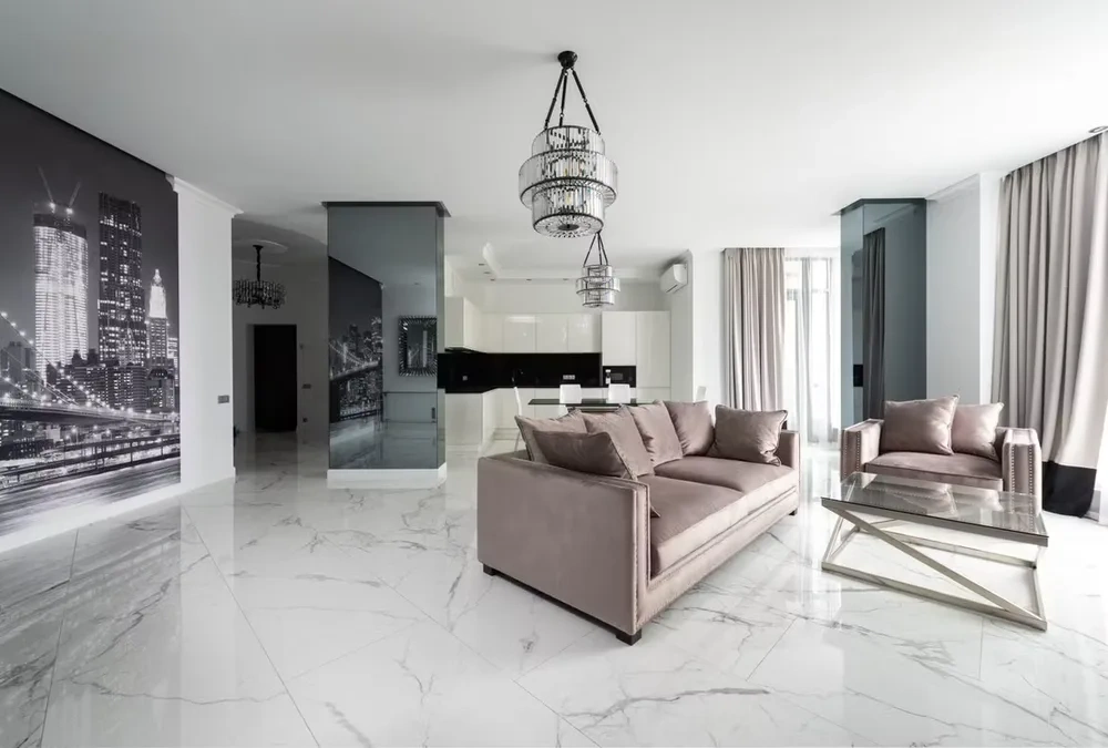 Living room with a stone media wall and integrated shelving